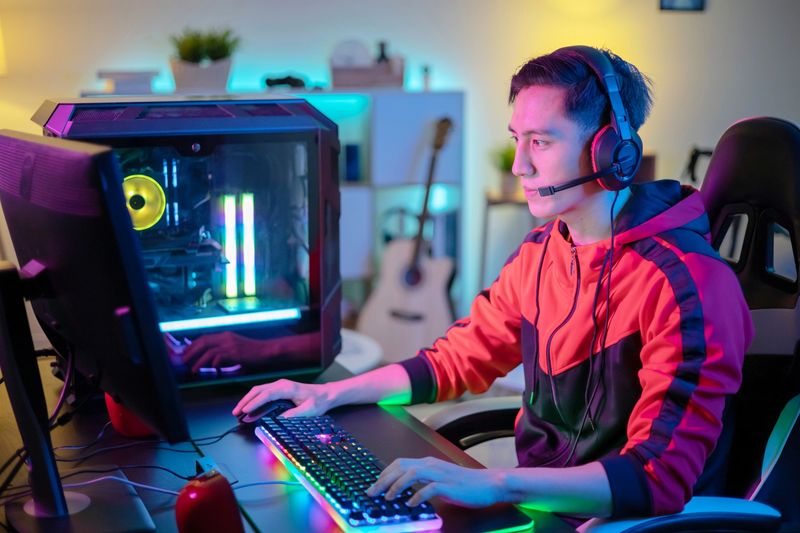 a male esports player gaming on a computer