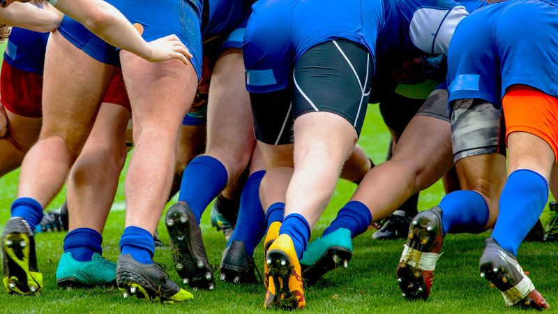 rugby players pushing forward in a scrum
