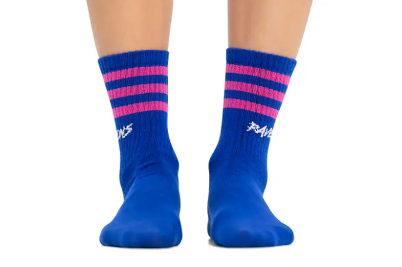 a pair of blue socks with pink stripes against a white background