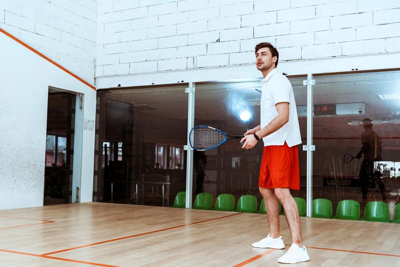 an adult male training at squash alone
