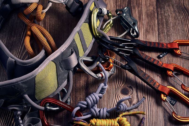 a rock climbing harness lying on a wooden table
