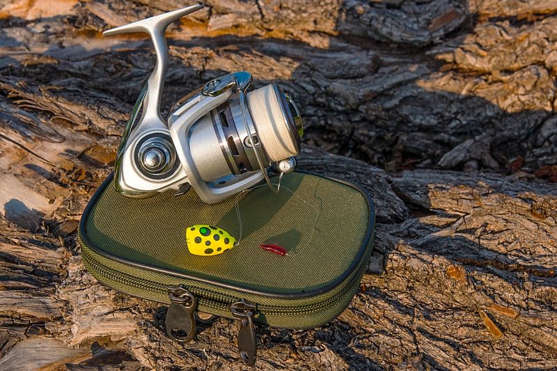 a fishing reel on a storage bag