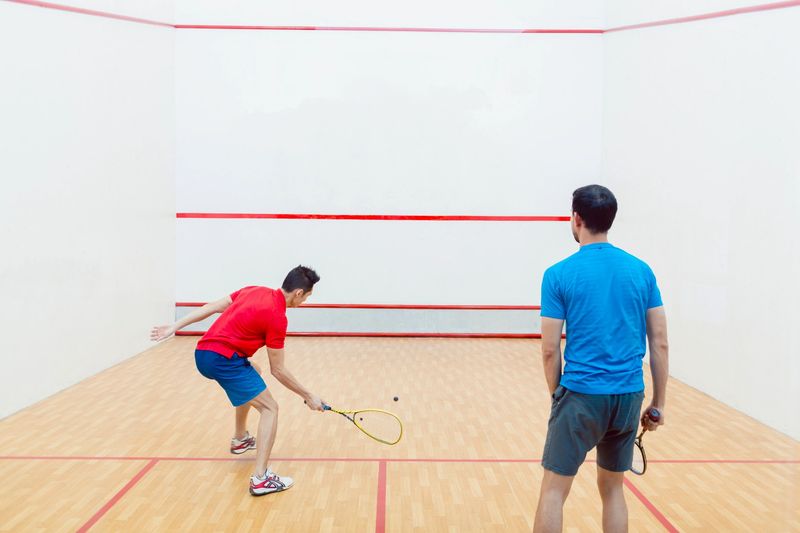two men playing squash