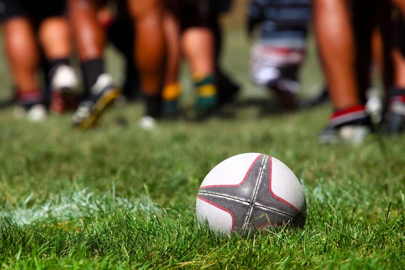 a rugby ball lying on grass
