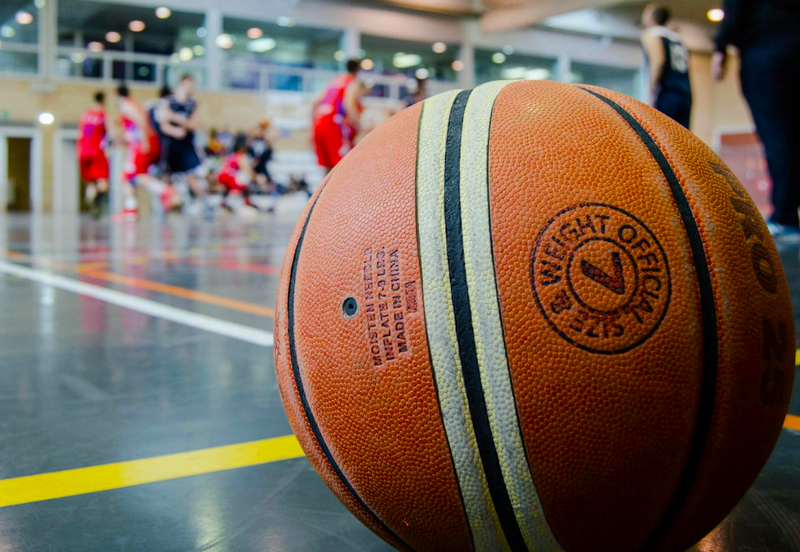 a size 7 basketball in front a basketball game