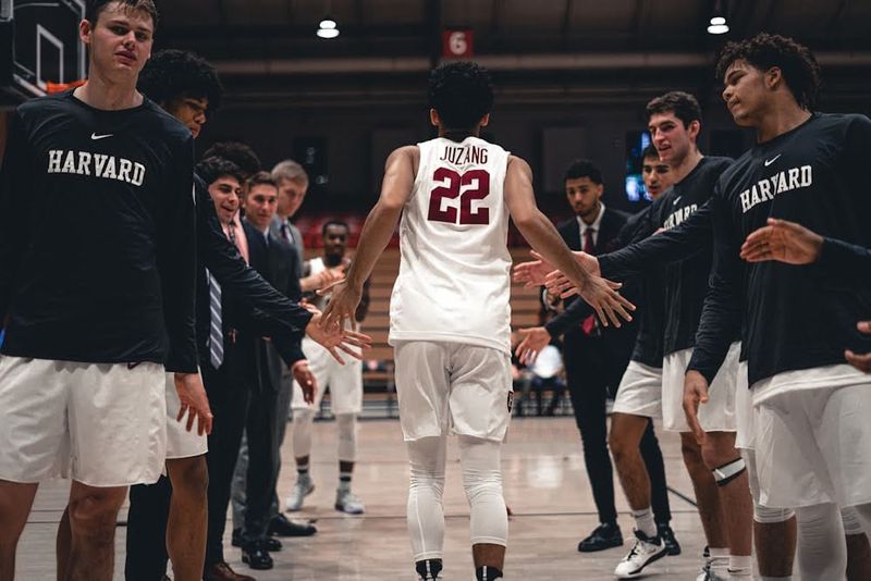 Basketball team welcoming player to court