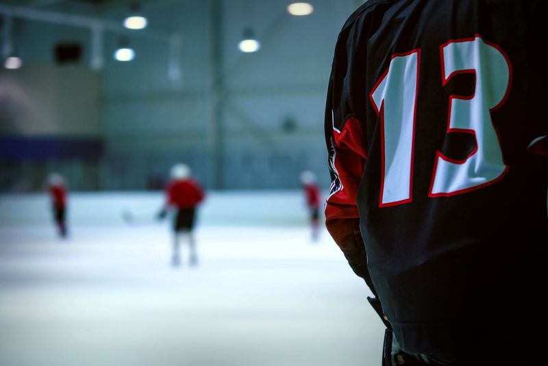 the back of a hockey jersey on a player skating on ice