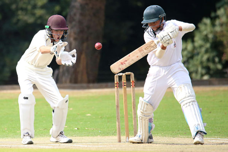 two cricket players on a cricket field