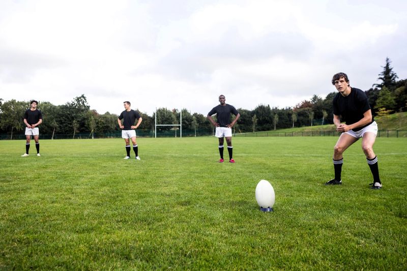 rugby players training on a rugby pitch