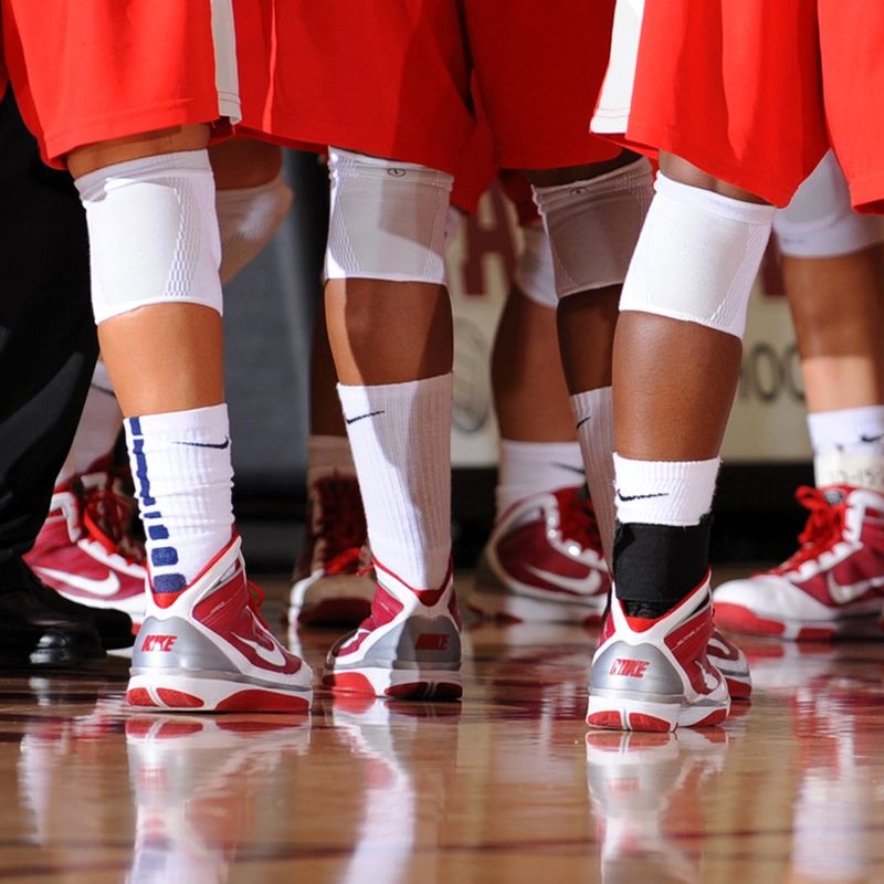 a basketball team wearing matching custom basketball shoes