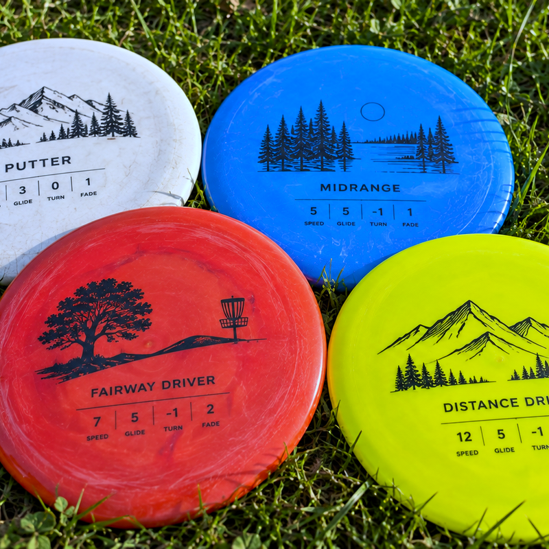 a disc golf starter disc set lying on grass