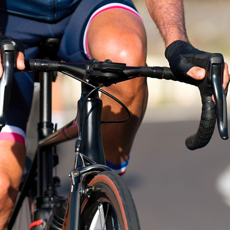 a male adult cyclist riding outdoors