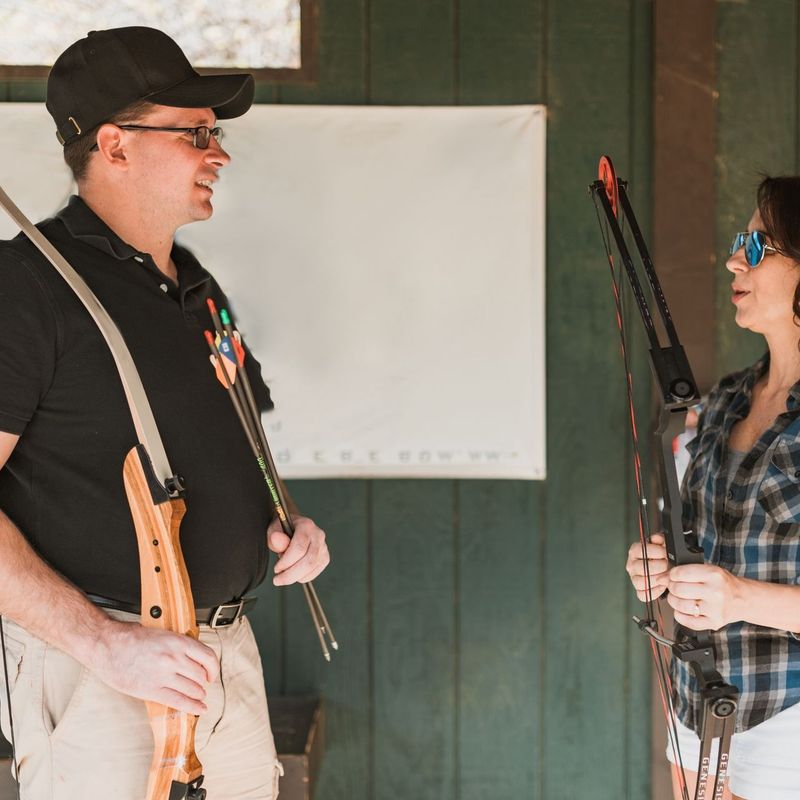 Man and woman with archery equipment